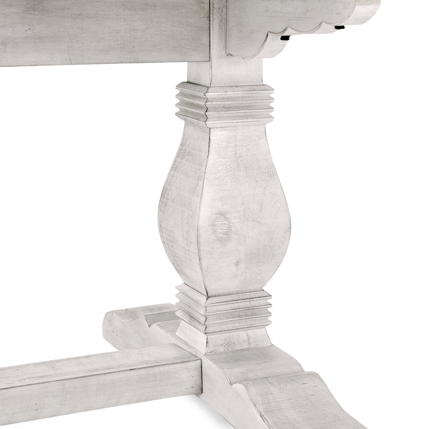 Closeup of a distressed white wood baluster leg for a dining table