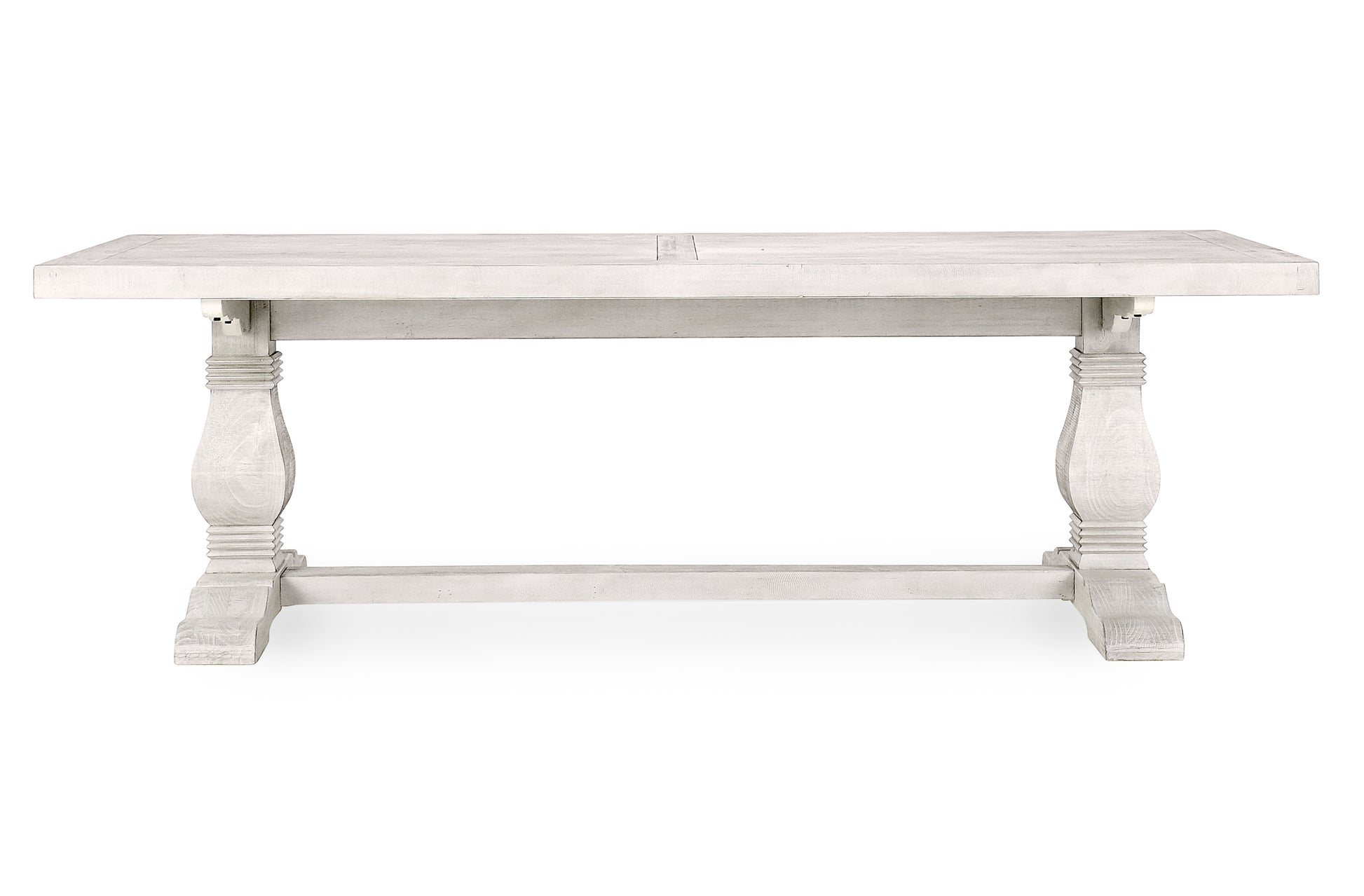 Distressed white wood dining table with pedestal legs perfect for farmhouse style dining