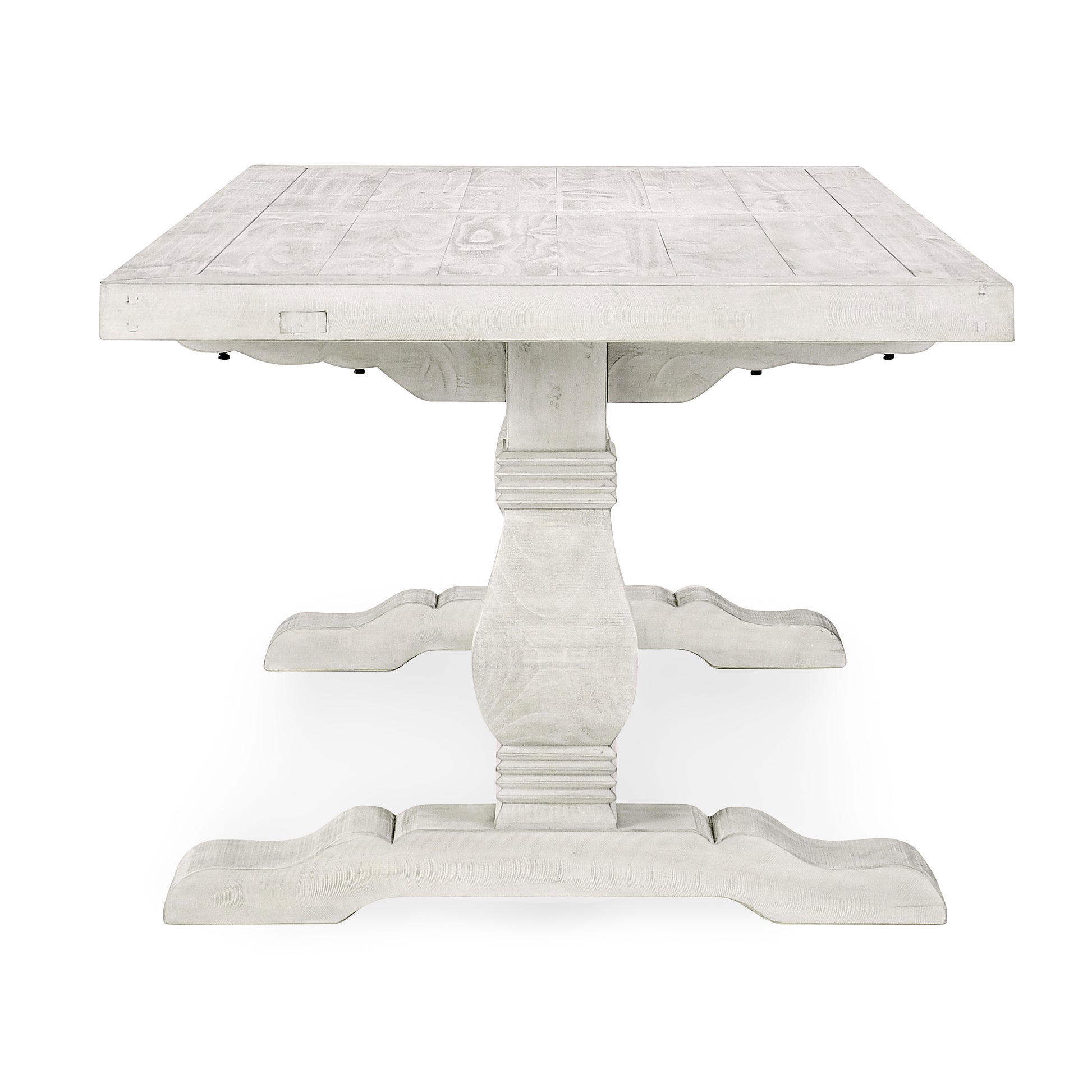White distressed wood pedestal dining table with plank top