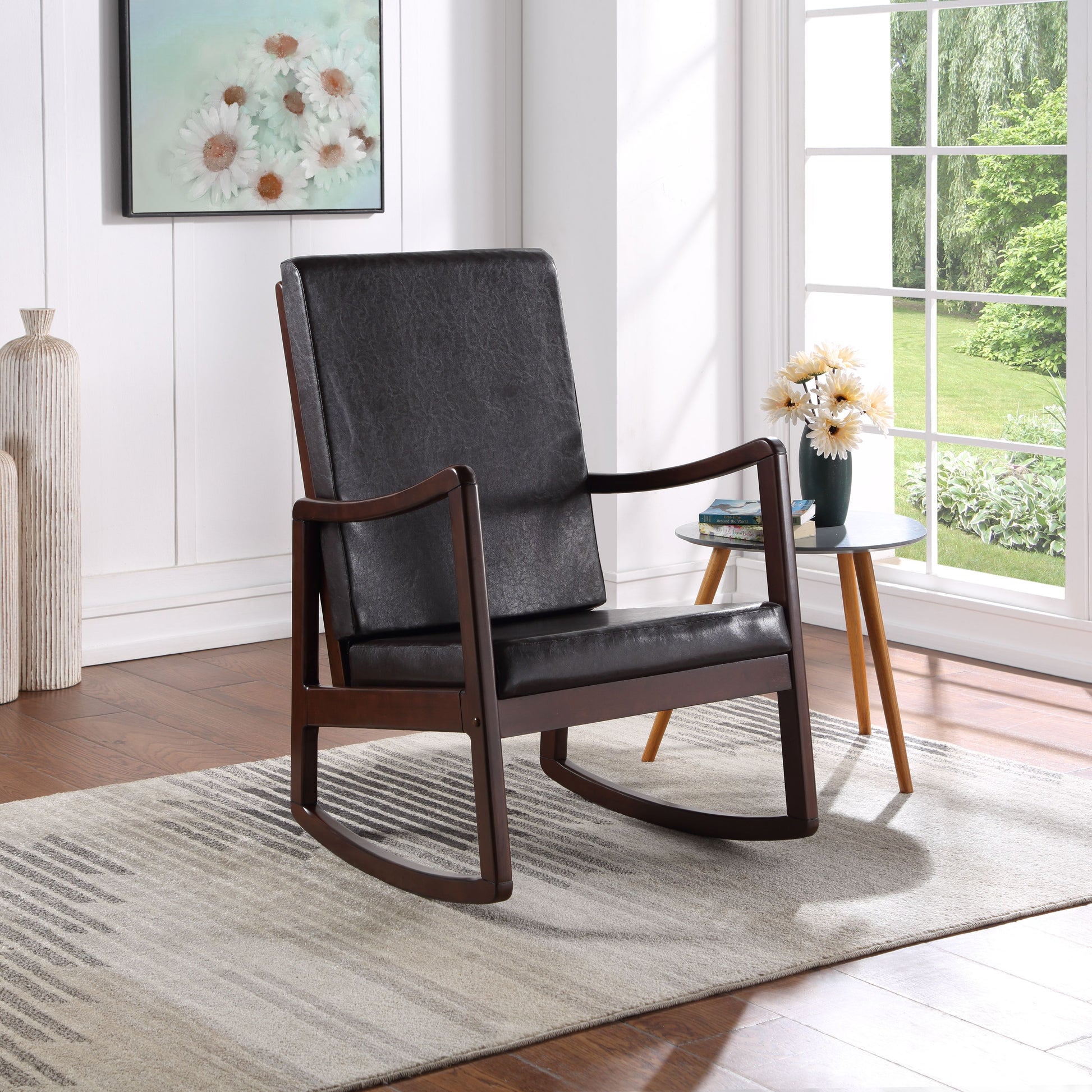 Dark brown faux leather rocking chair with wooden frame on striped rug