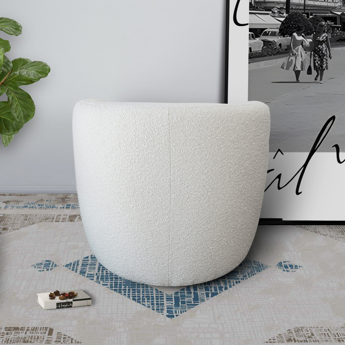 Plush white boucle ottoman with a rounded modern silhouette perfect for adding comfort to any living space