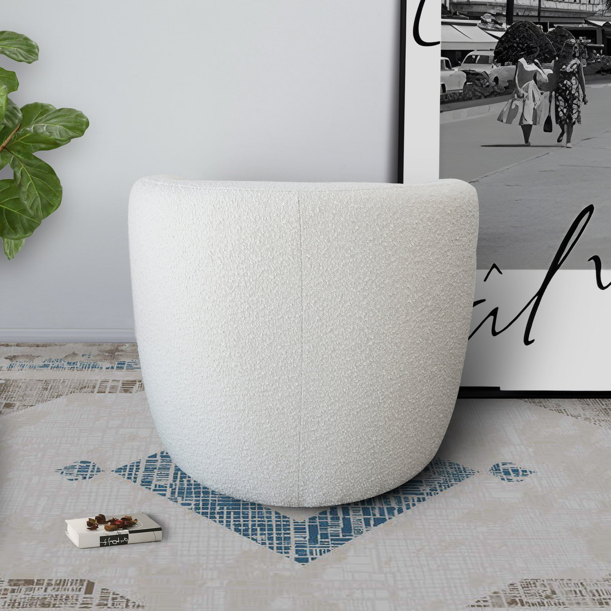 Plush white boucle ottoman with a rounded modern silhouette perfect for adding comfort to any living space