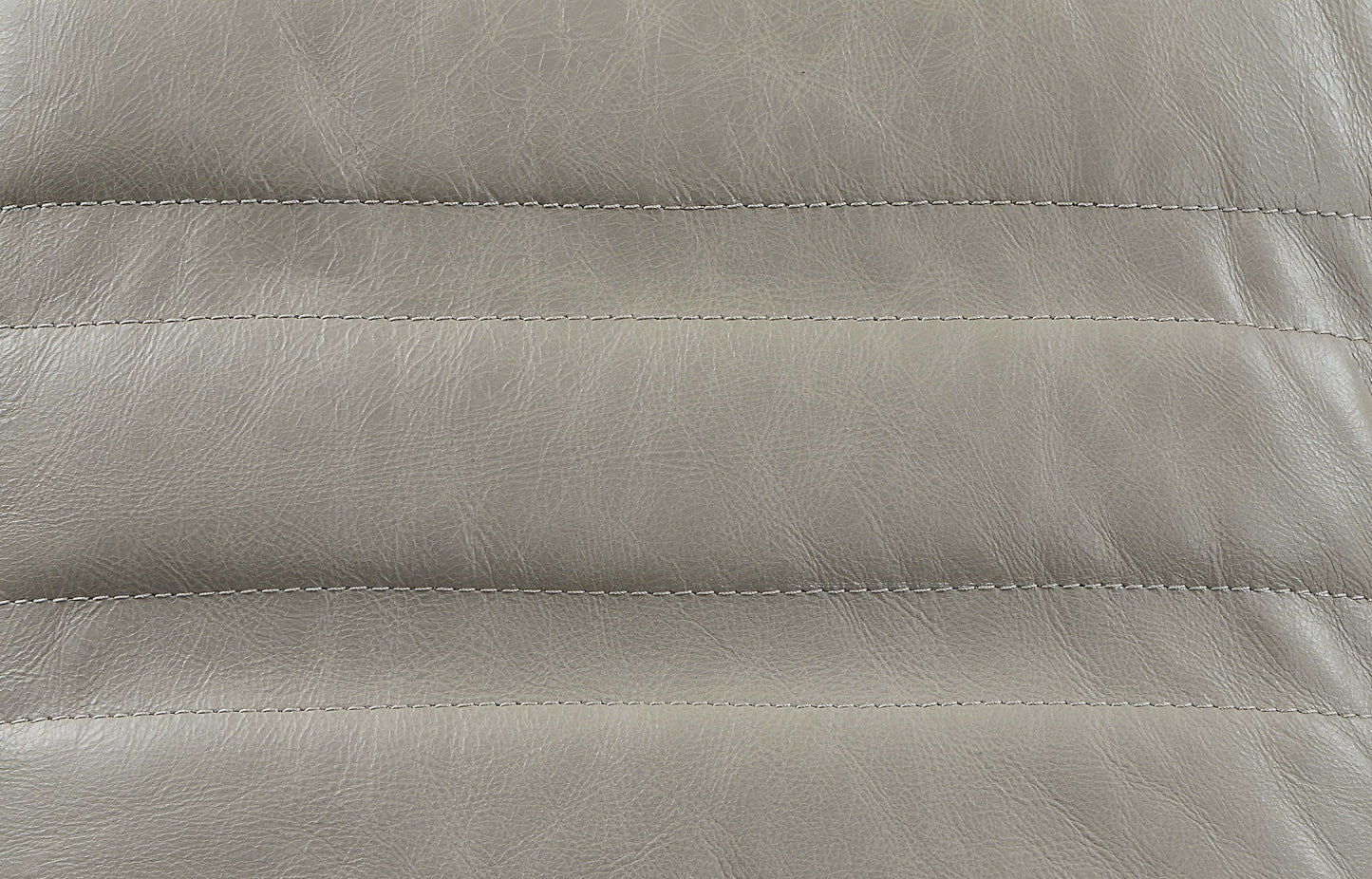 Closeup of grey faux leather texture with parallel stitching ideal for upholstery