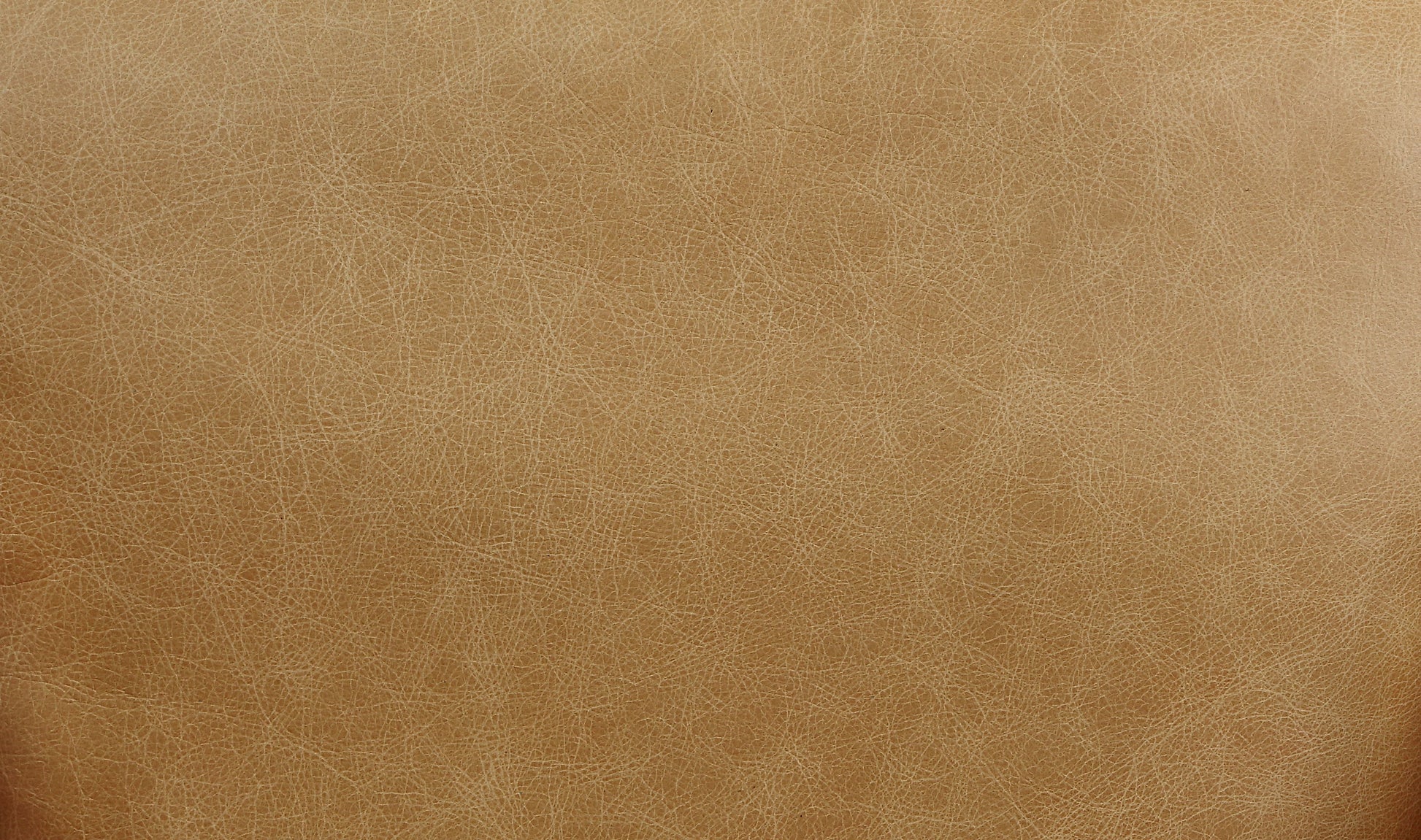 Tan distressed faux leather upholstery fabric with a subtle texture