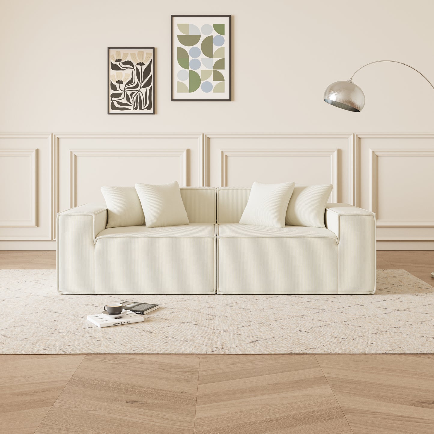 Cream corduroy sofa with plush white throw pillows perfect for a modern living room