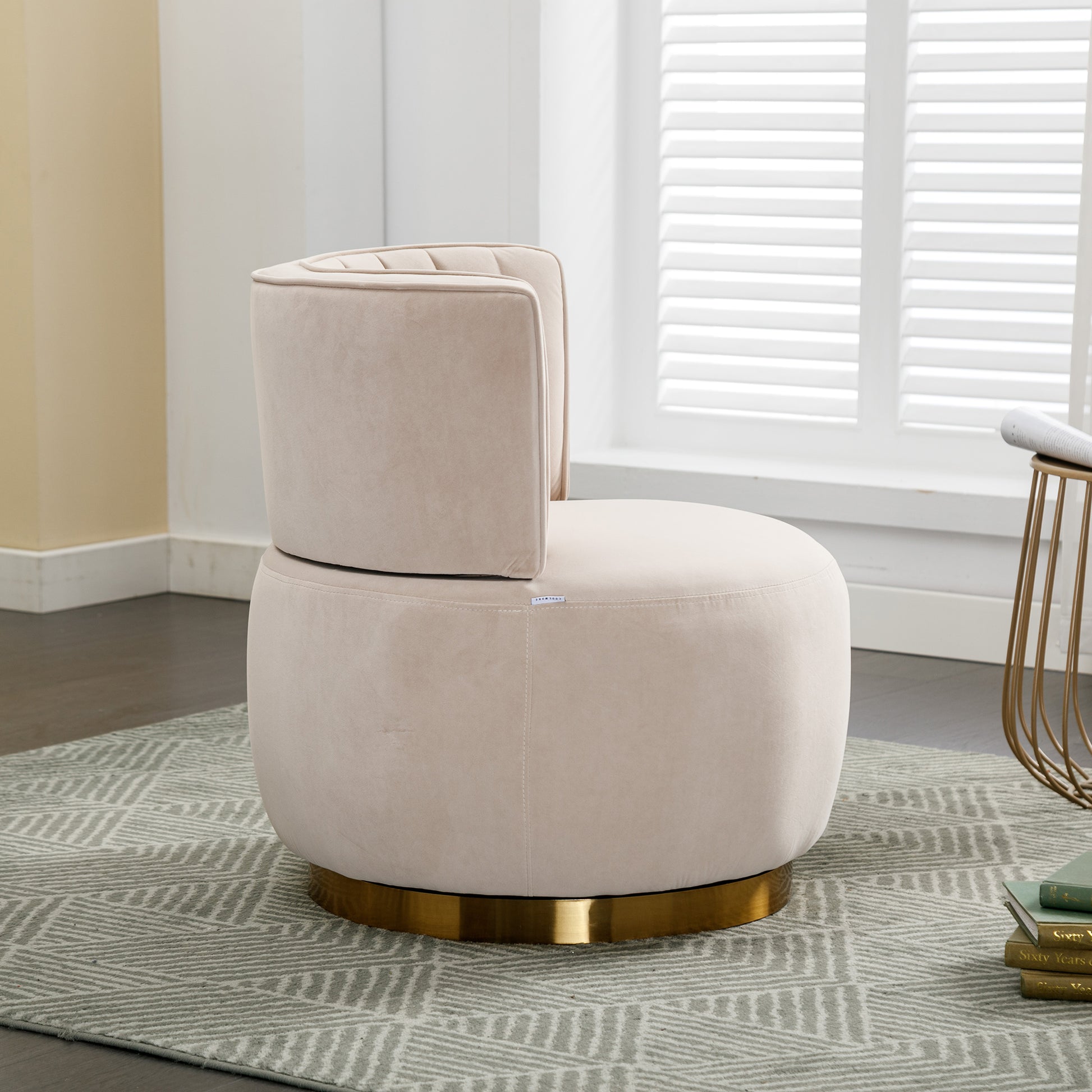 Plush cream velvet accent chair with a gold swivel base perfect for modern living rooms