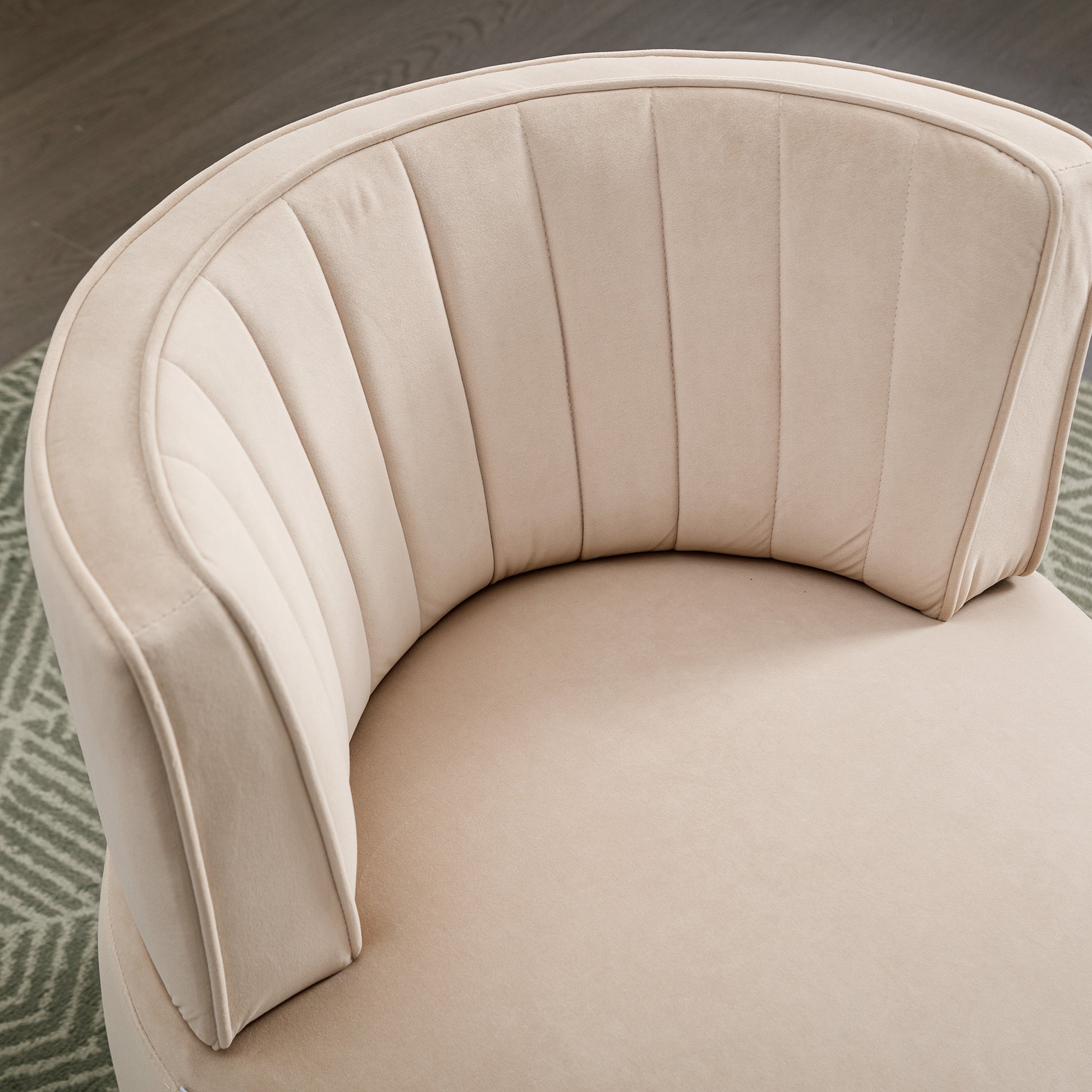 Cream velvet accent chair with channel tufting and a curved back
