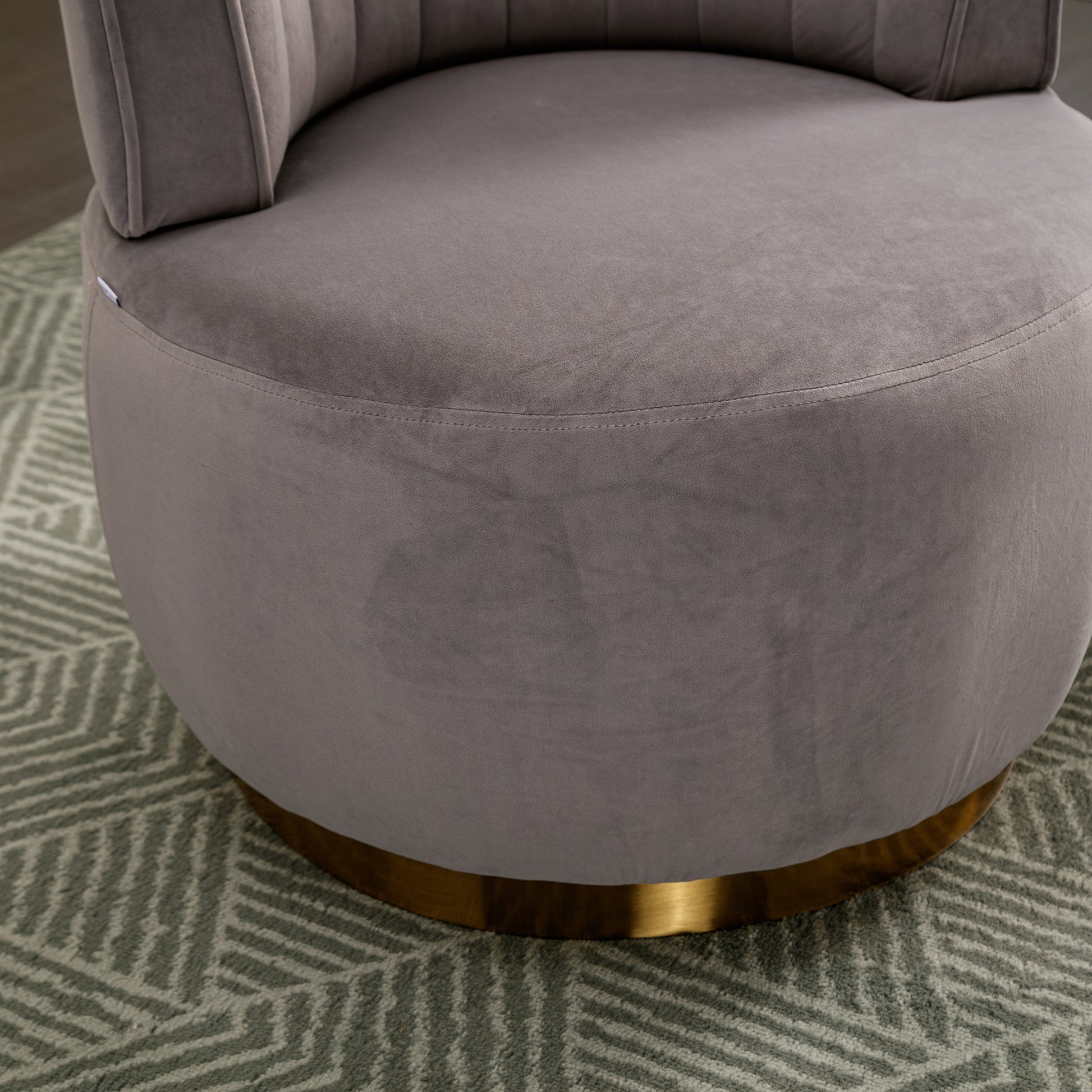 Plush grey velvet accent chair with gold metal base and tufted backrest
