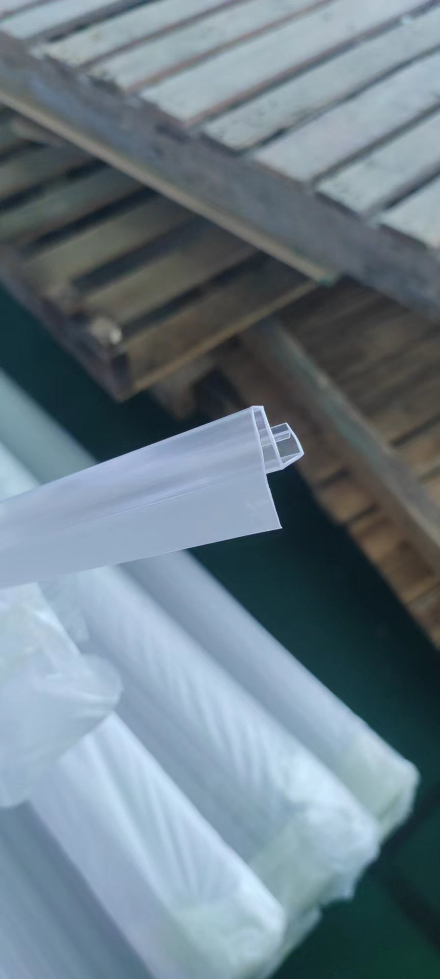 Clear plastic shelf edge strips with a hinged design for easy label insertion