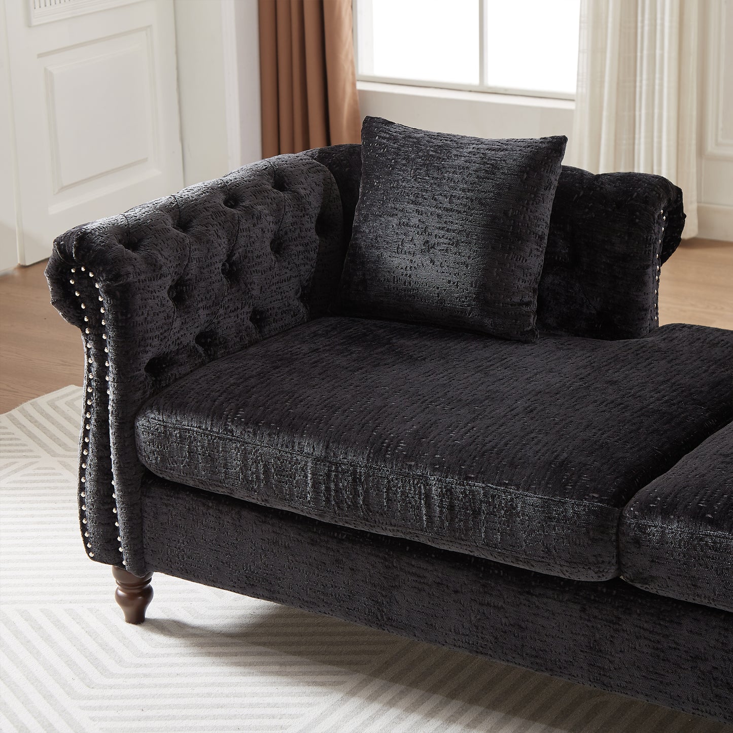 Black chenille chesterfield sofa with diamond tufting and studded arms
