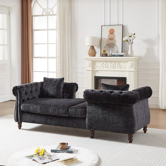 Dark grey tufted velvet sofa with silver nailhead trim ideal for a luxurious living room