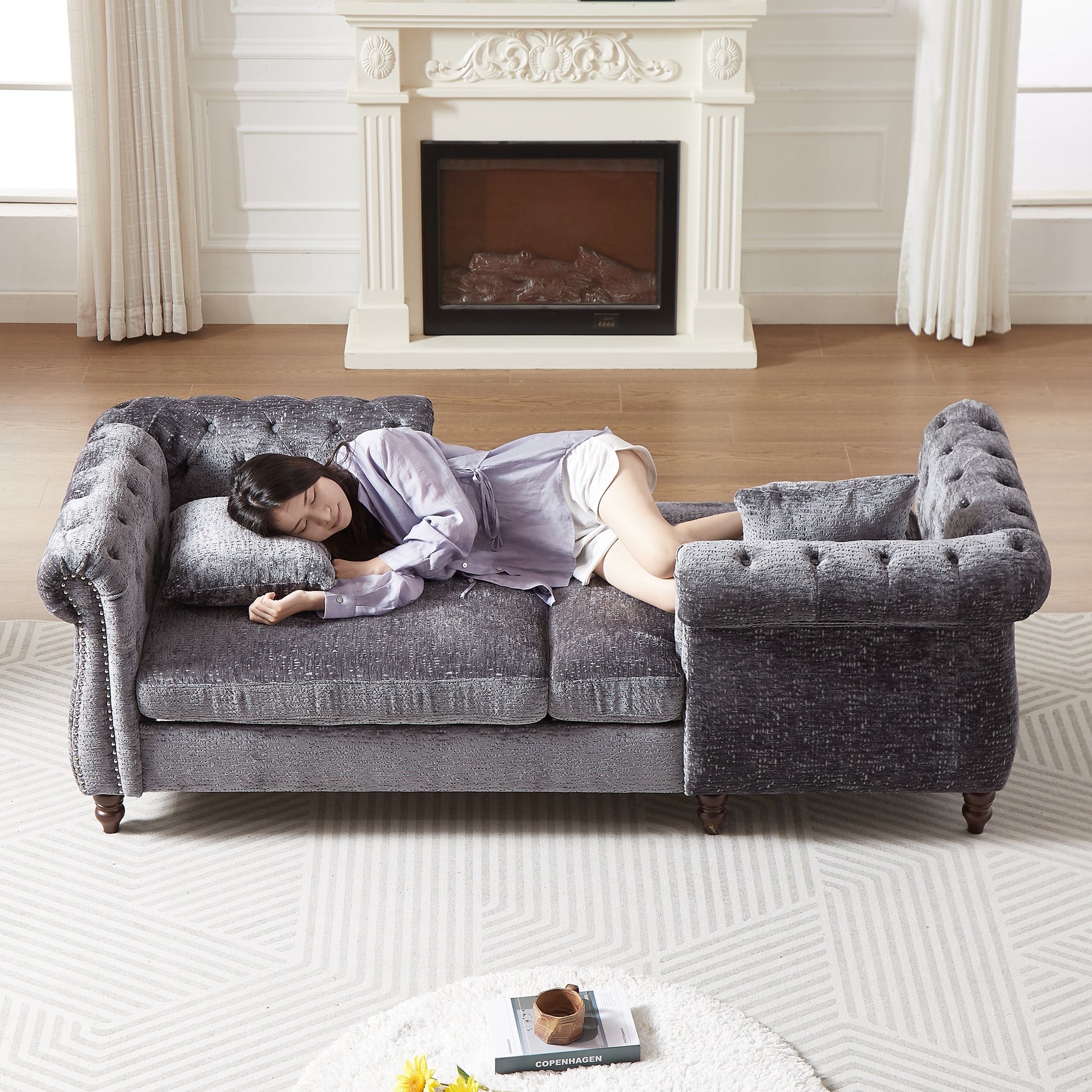 Gray velvet chesterfield sofa with tufted back and nailhead trim