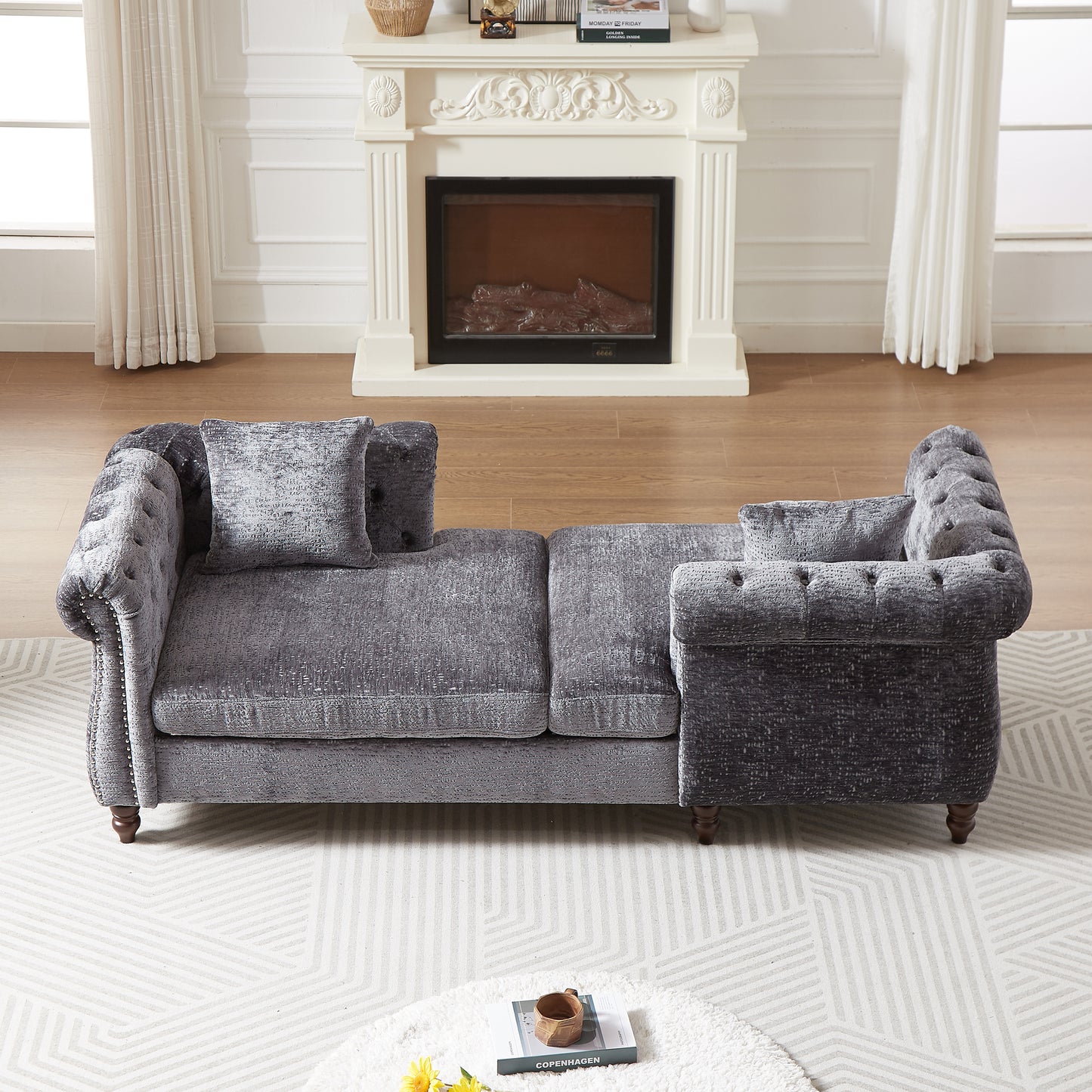 Elegant dark grey velvet chesterfield sofa with button tufting and nailhead trim