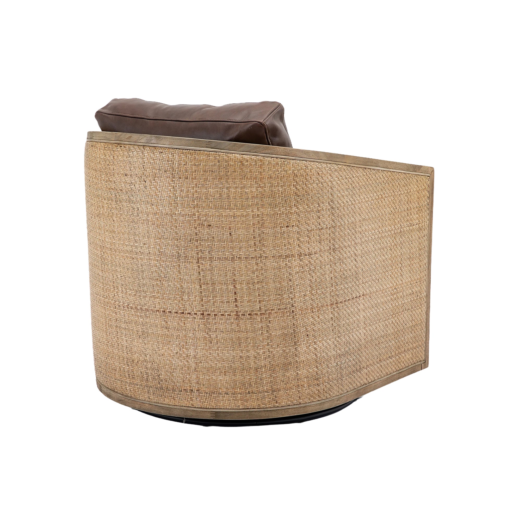 Curved barrel chair with brown leather pillow and natural rattan weave sides