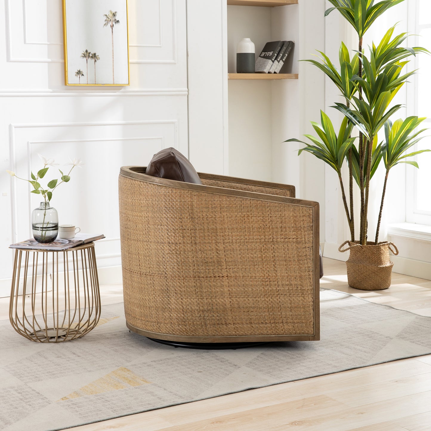 Round rattan accent chair with brown leather pillow and wooden trim