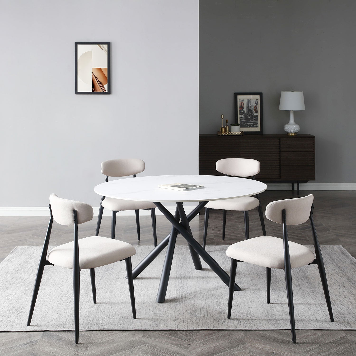 Modern round marble dining table with black metal legs seats four