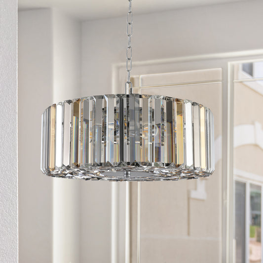 Modern crystal pendant light with chrome accents casting elegant reflections