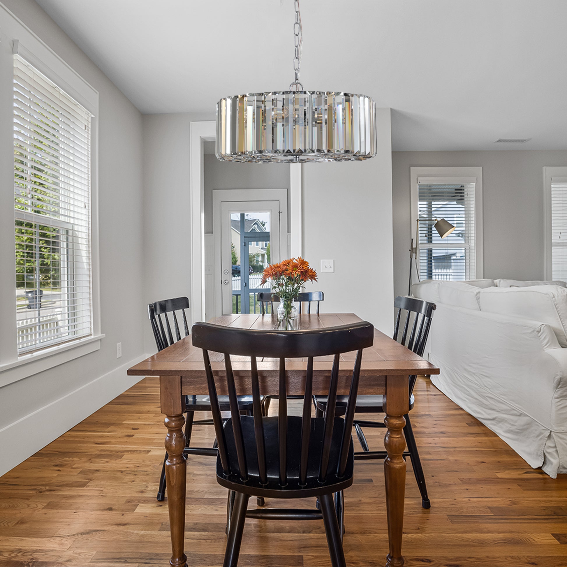 Modern crystal chandelier with chrome finish providing elegant lighting for dining rooms