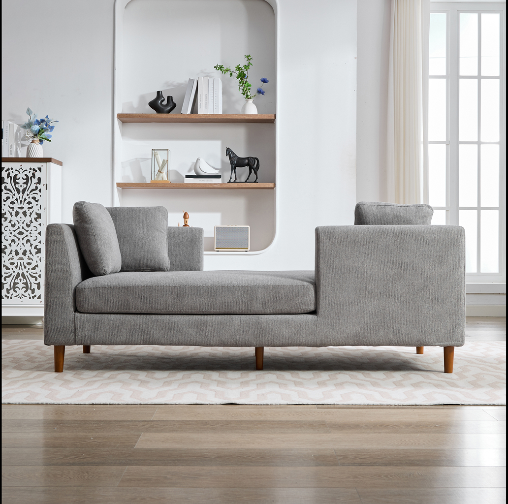 Grey upholstered chaise lounge with wooden legs and modern design