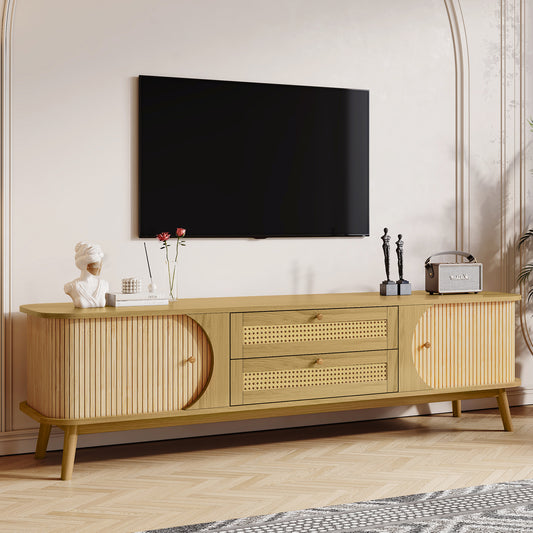 Light oak TV stand with ribbed doors cane panel drawers and tapered legs