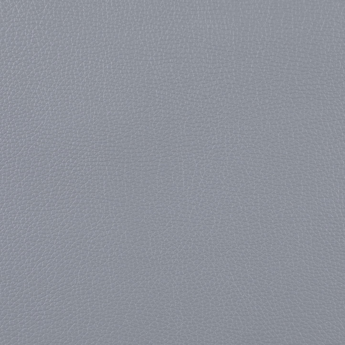 Closeup of textured grey faux leather material ideal for upholstery projects