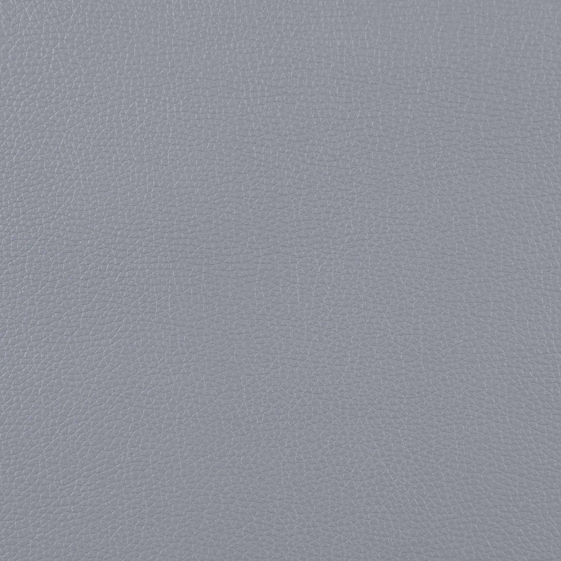 Closeup of textured grey faux leather material ideal for upholstery projects