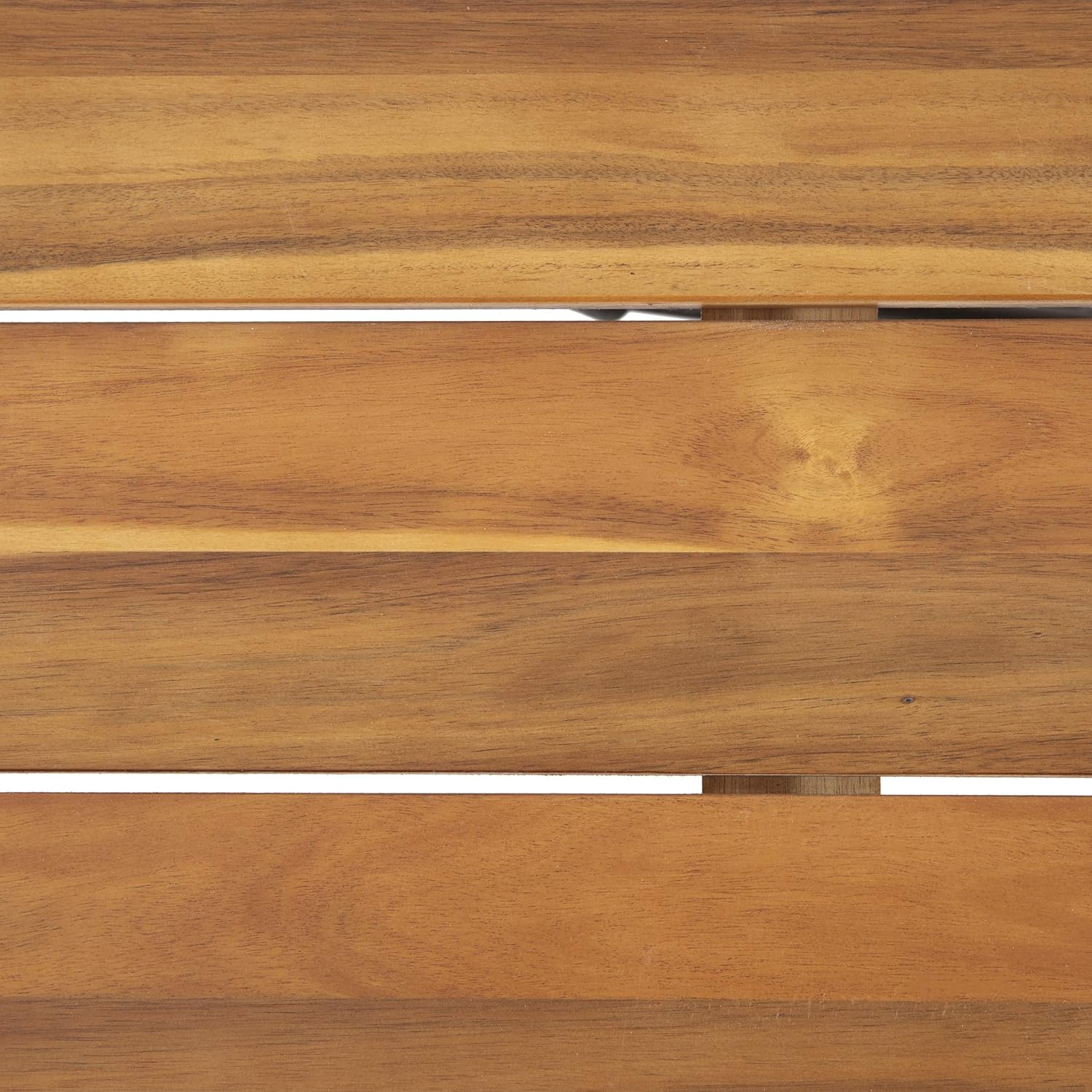 Closeup of natural acacia wood grain on a slatted surface for outdoor furniture