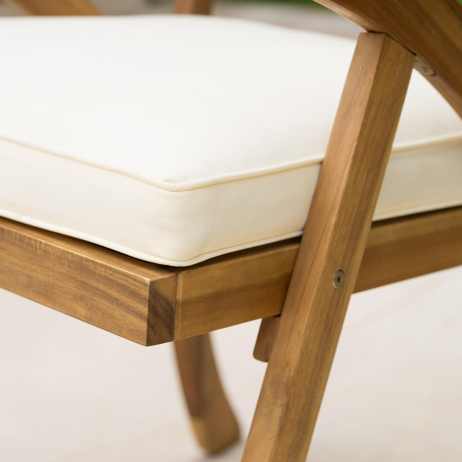 Closeup of a cream outdoor chair cushion on a natural wood frame