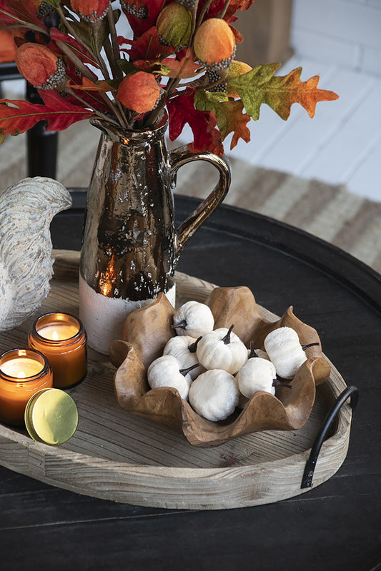 Set of  frosted white decorative pumpkins in a rustic wooden bowl