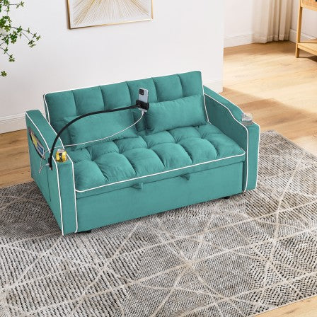 Teal velvet futon with tufted cushions and a phone holder ideal for small apartments