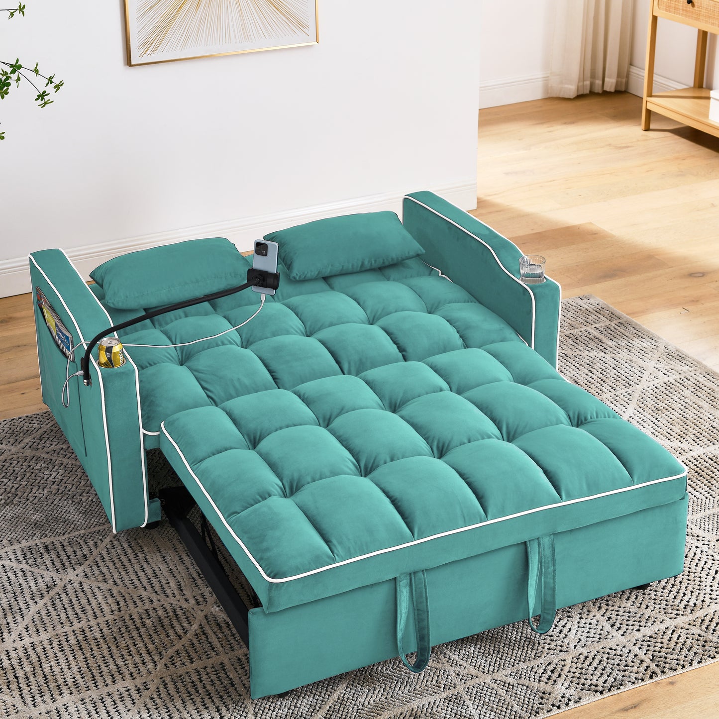 Teal velvet sofa bed with tufted cushions and white piping perfect for small spaces