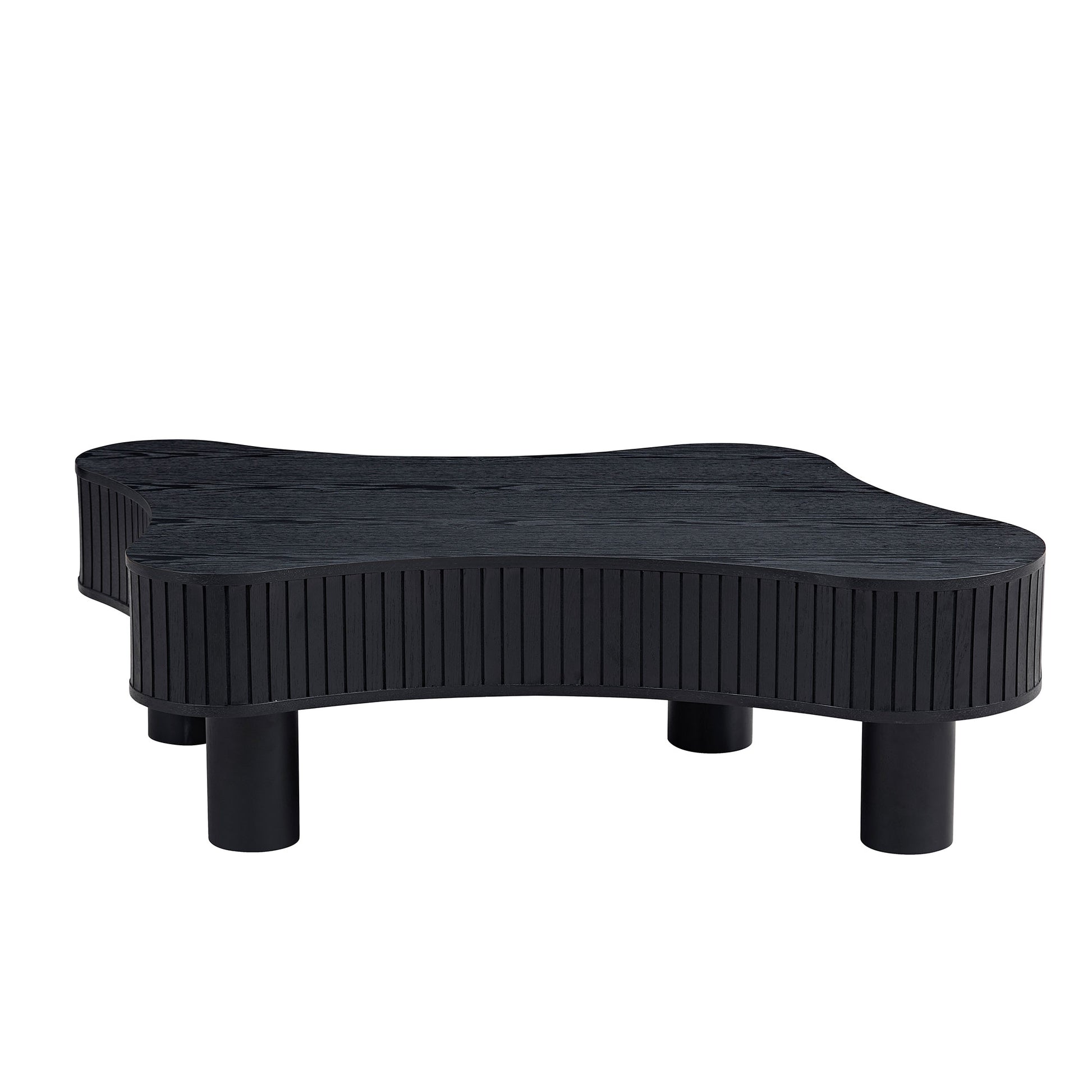 Black abstractshaped coffee table with ribbed sides and round legs