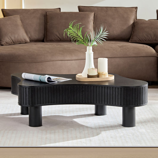 Black wooden coffee table with ribbed detailing and rounded legs