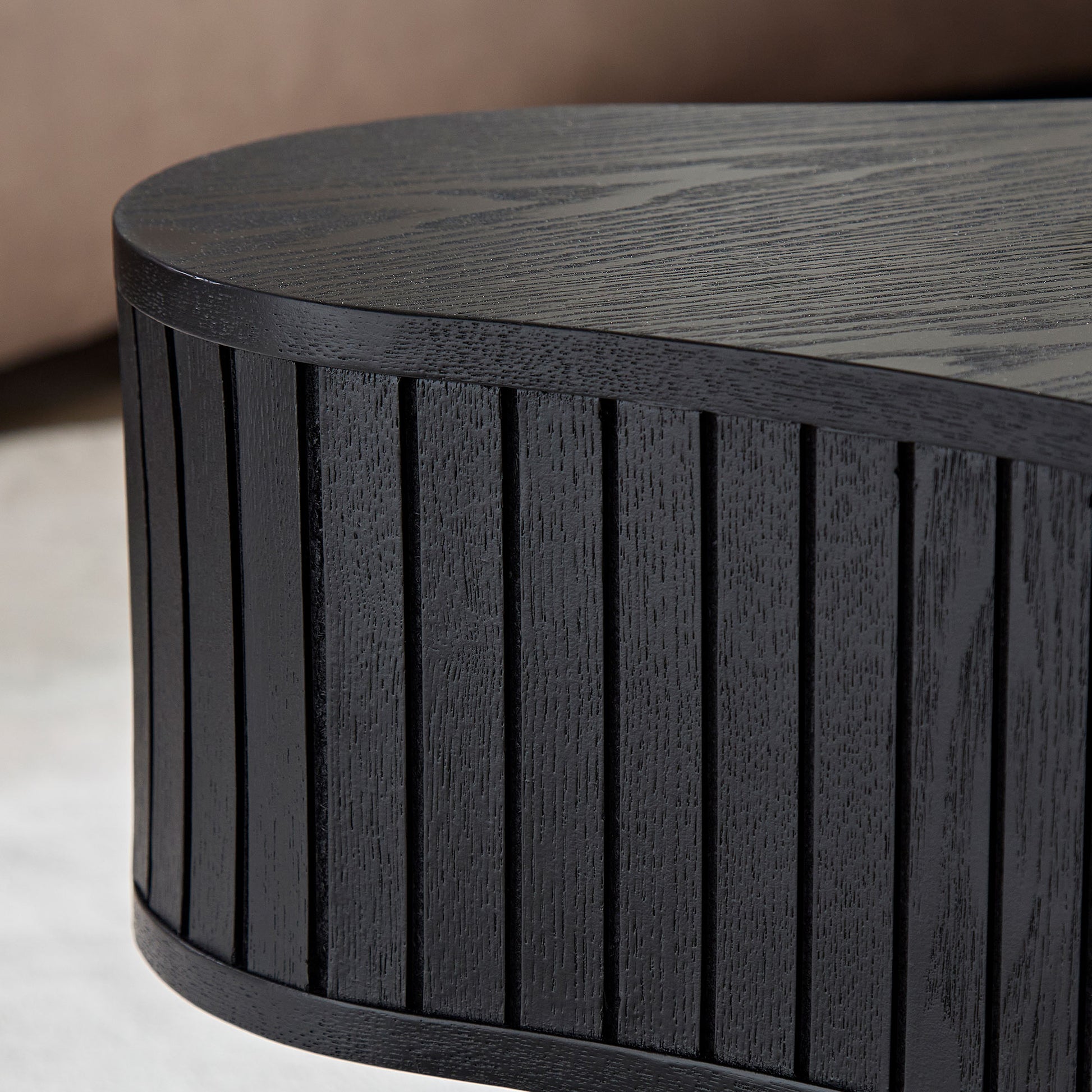 Textured black wood coffee table with grooved side detail