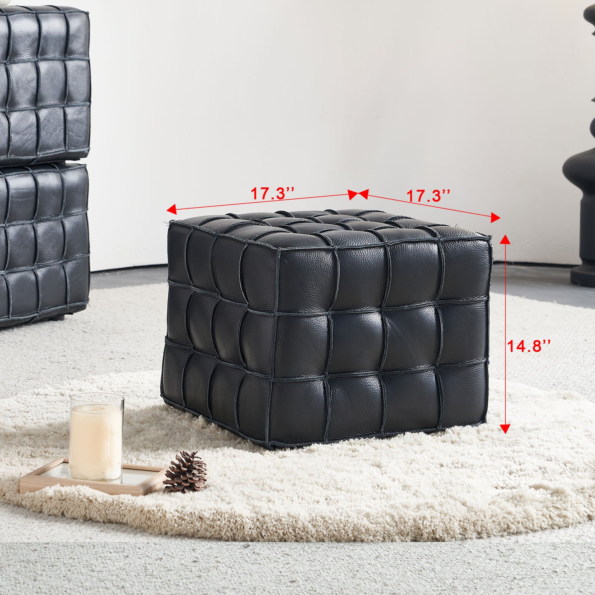 Black tufted faux leather ottoman with woven design perfect for modern living rooms