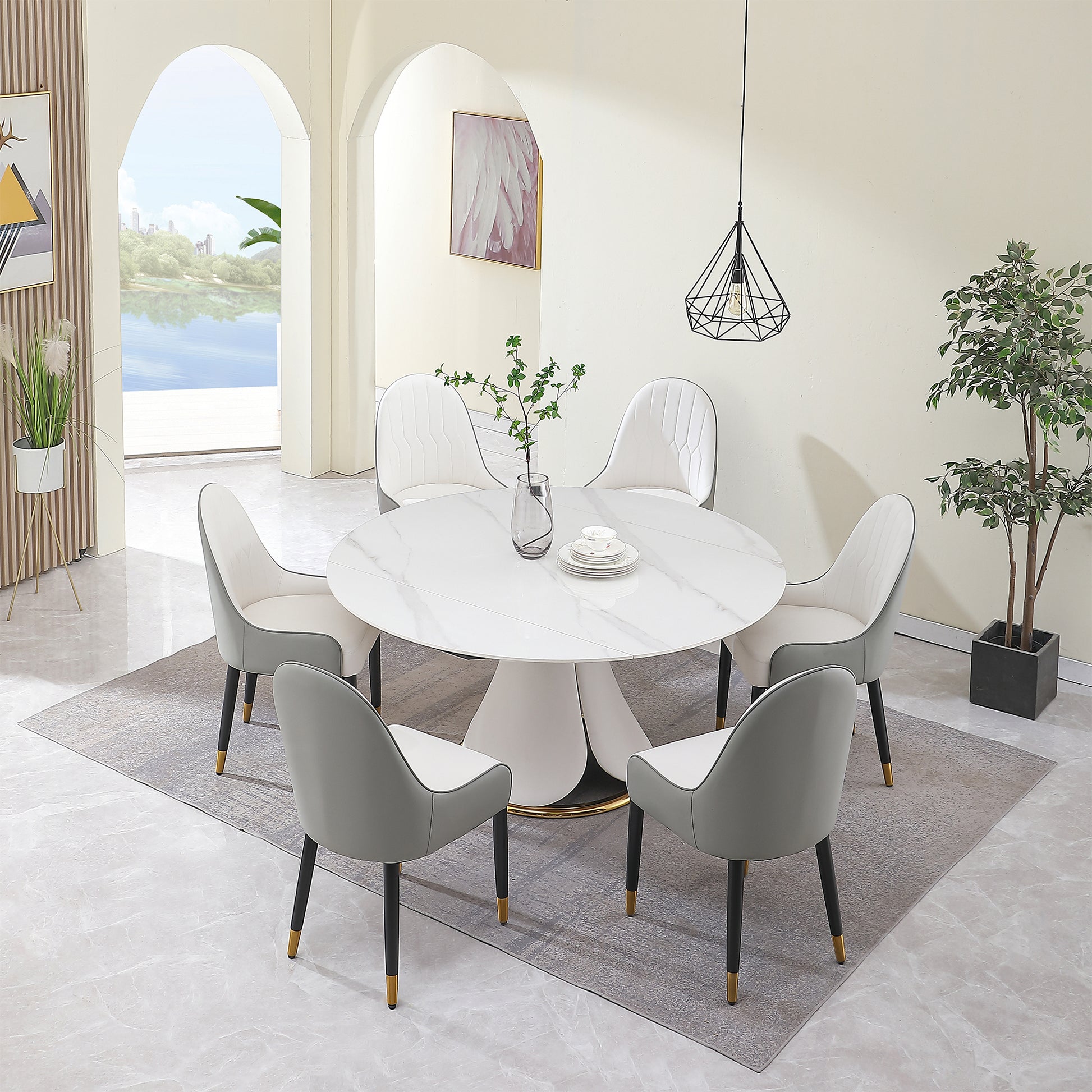 Round marble dining table with five upholstered chairs in grey and white