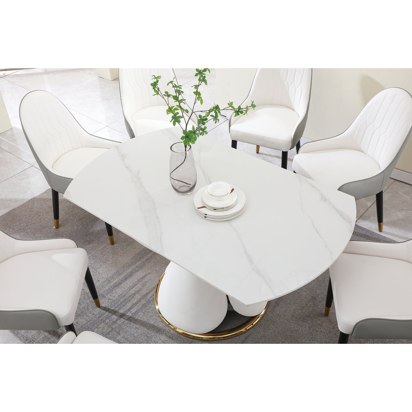 White marble dining table with gold base and six upholstered chairs