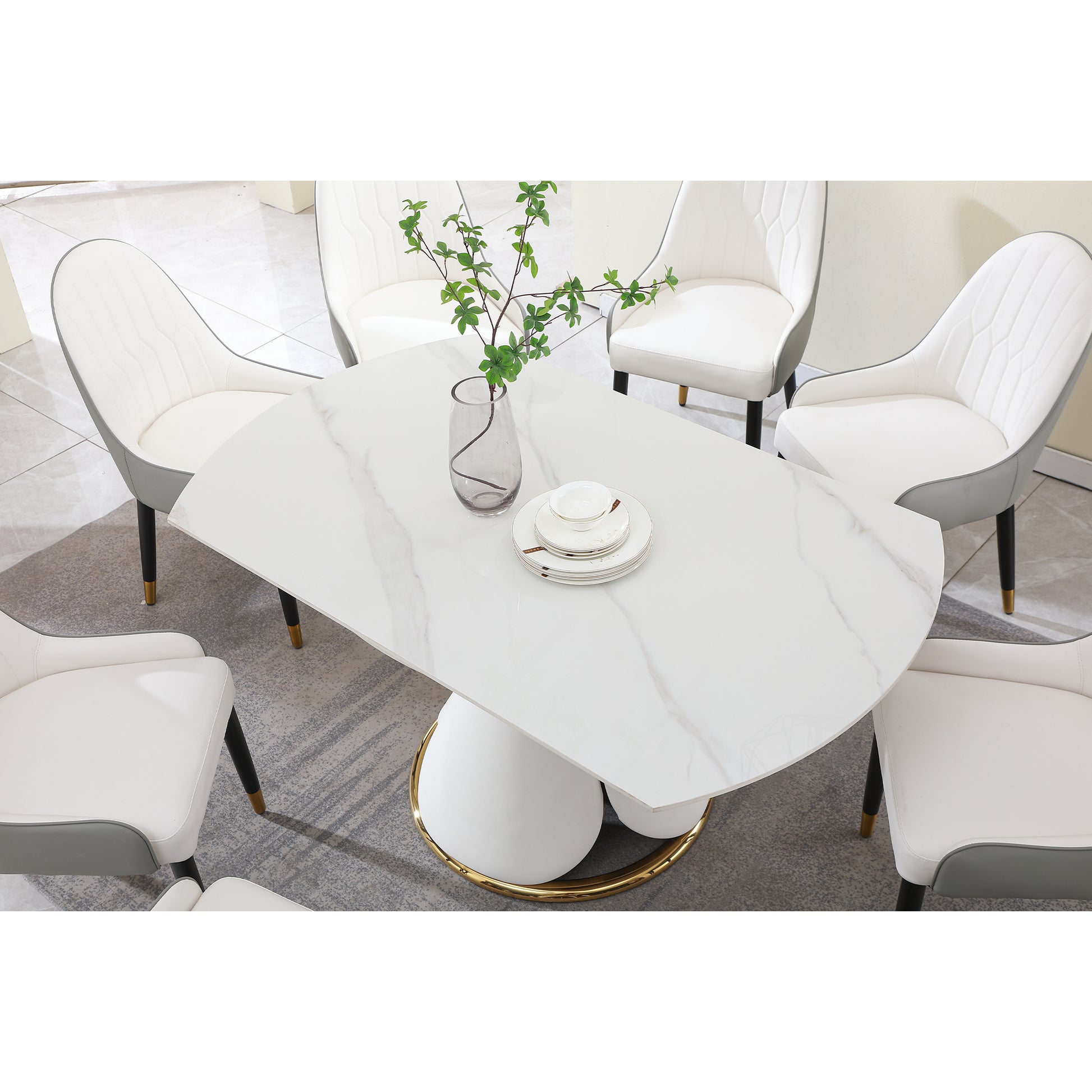 White marble dining table with gold base and six upholstered chairs