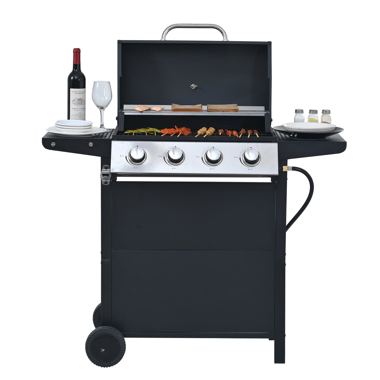 Black fourburner gas grill with food cooking on grates and side shelves holding plates and wine