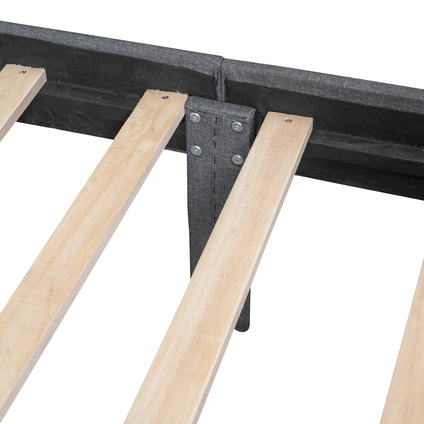 Closeup of a dark grey upholstered bed frame with wooden slats