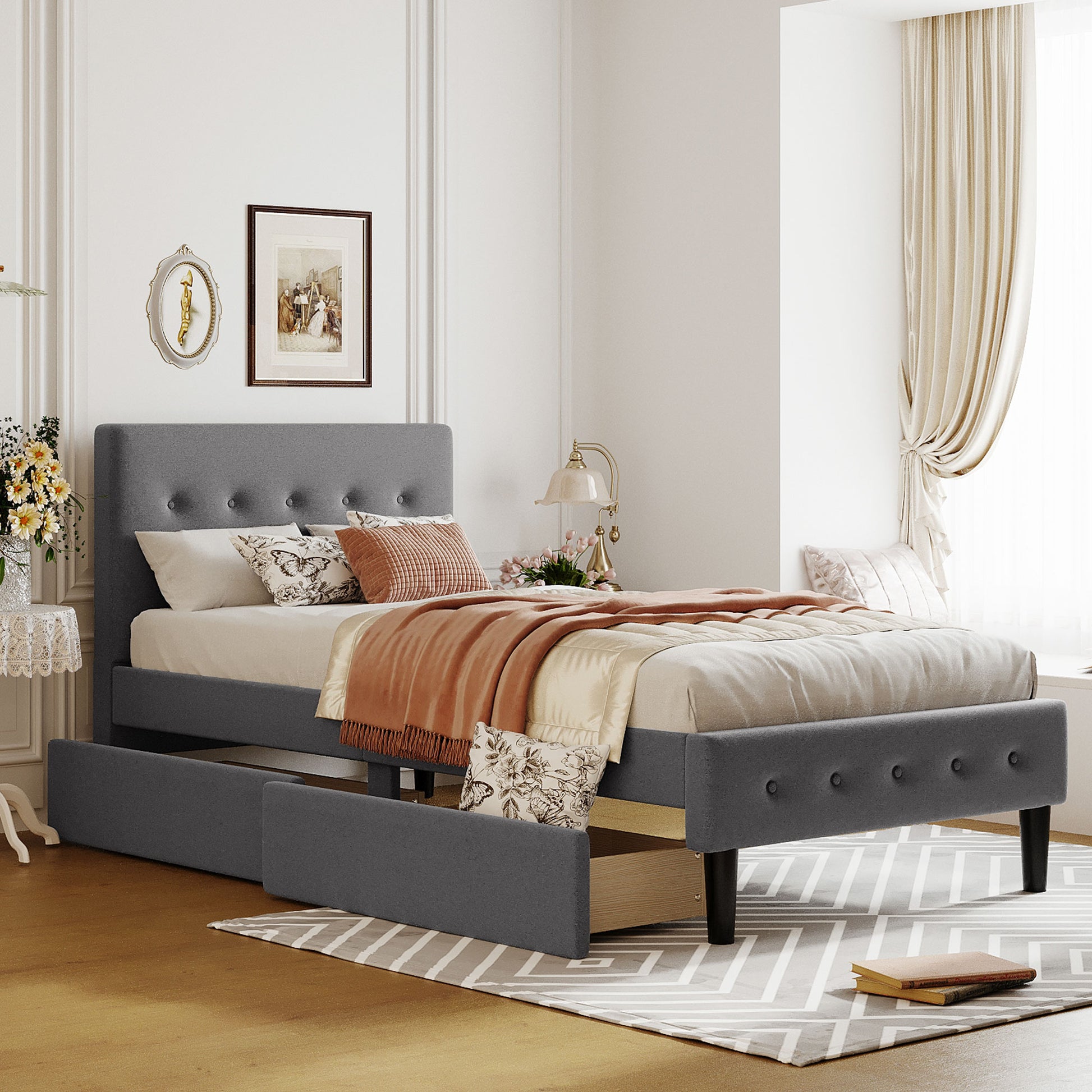 Gray upholstered twin bed frame with tufted headboard and storage drawers