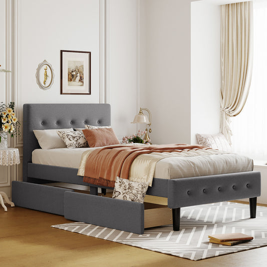 Gray upholstered twin bed frame with tufted headboard and storage drawers