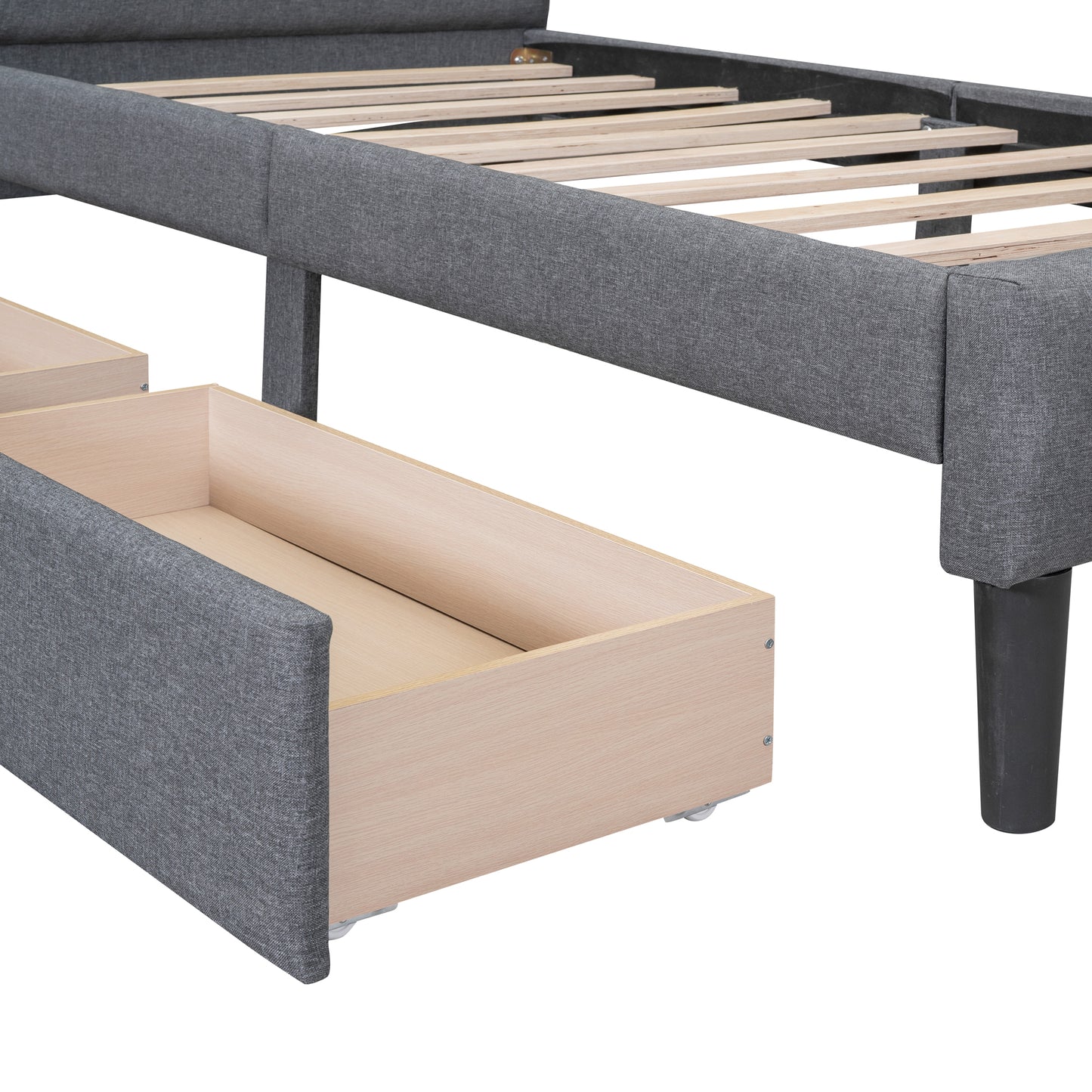 Gray fabric bed frame with visible storage drawers and wooden slats