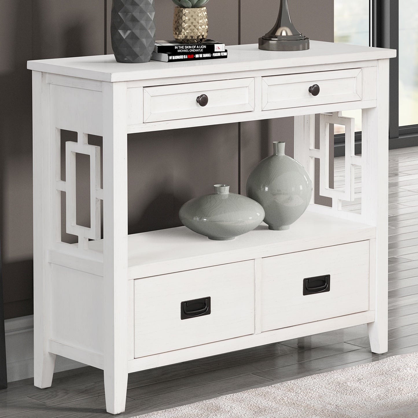 White console table with geometric cutouts and four drawers for entryway storage