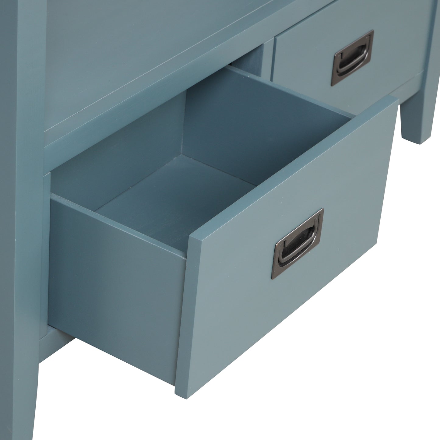 Closeup of open drawer on blue wooden cabinet showcasing interior space