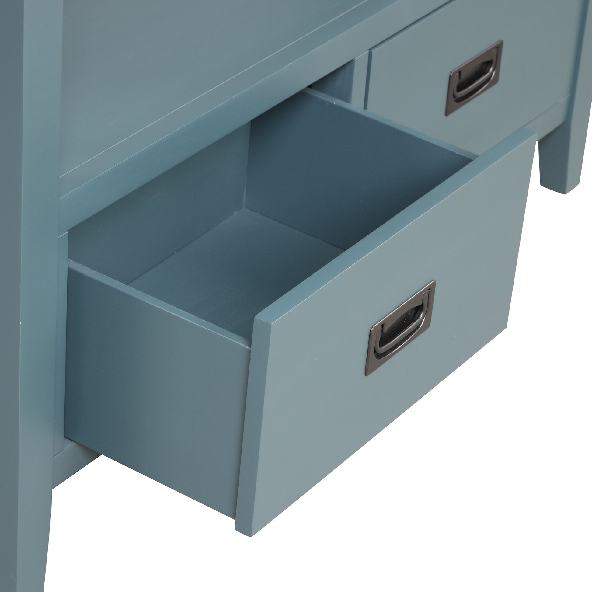 Closeup of open drawer on blue wooden cabinet showcasing interior space