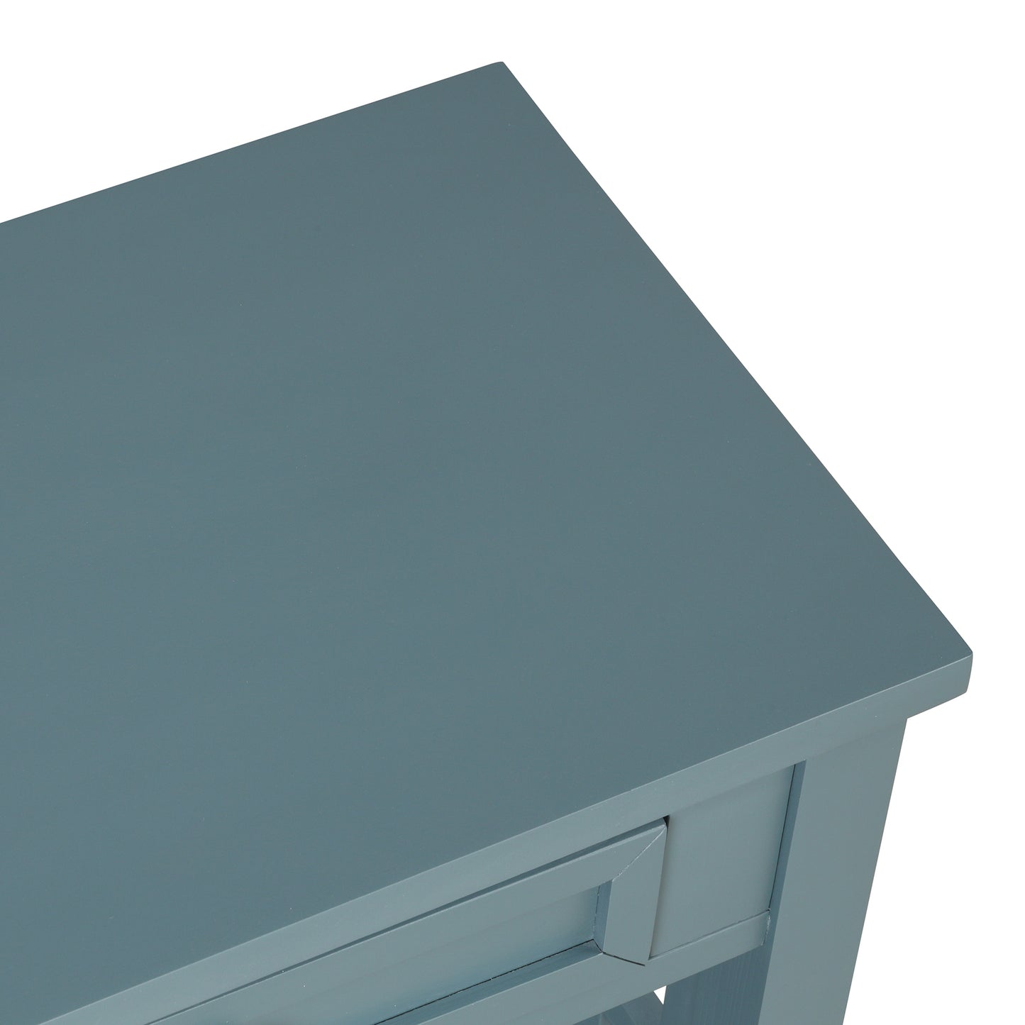 Closeup of a dusty blue console table top with a visible drawer front detail