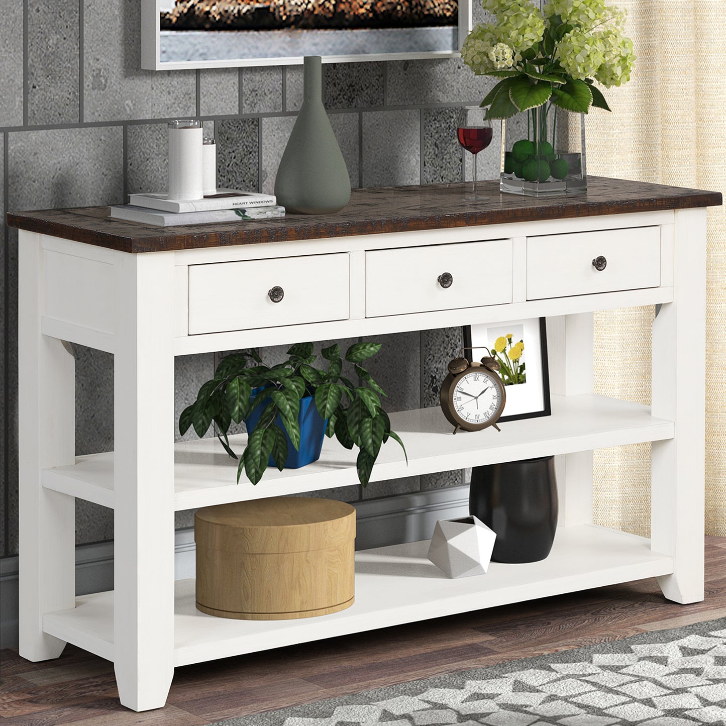 White console table with dark wood top and three drawers perfect for entryways