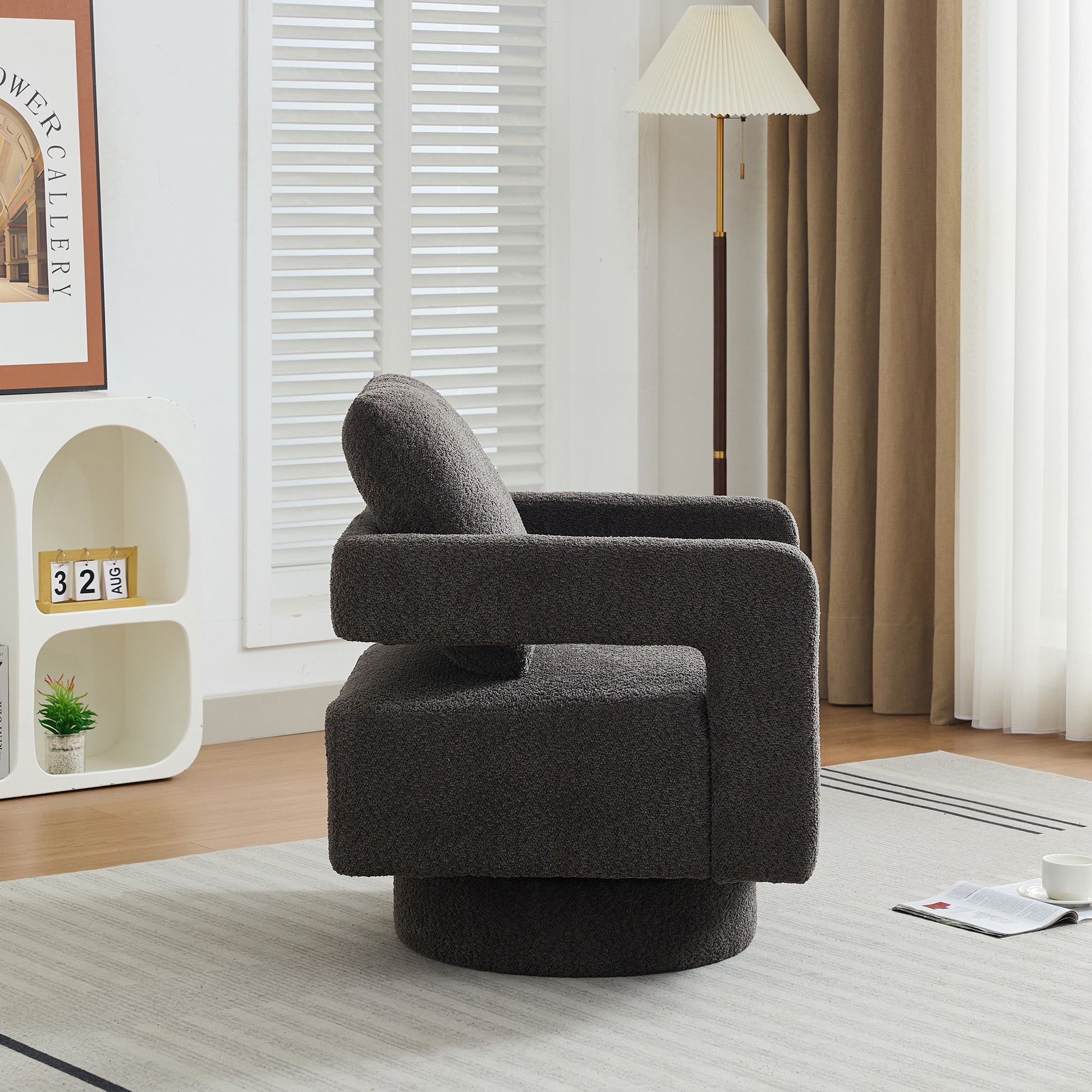 Modern dark gray boucle swivel accent chair with plush texture