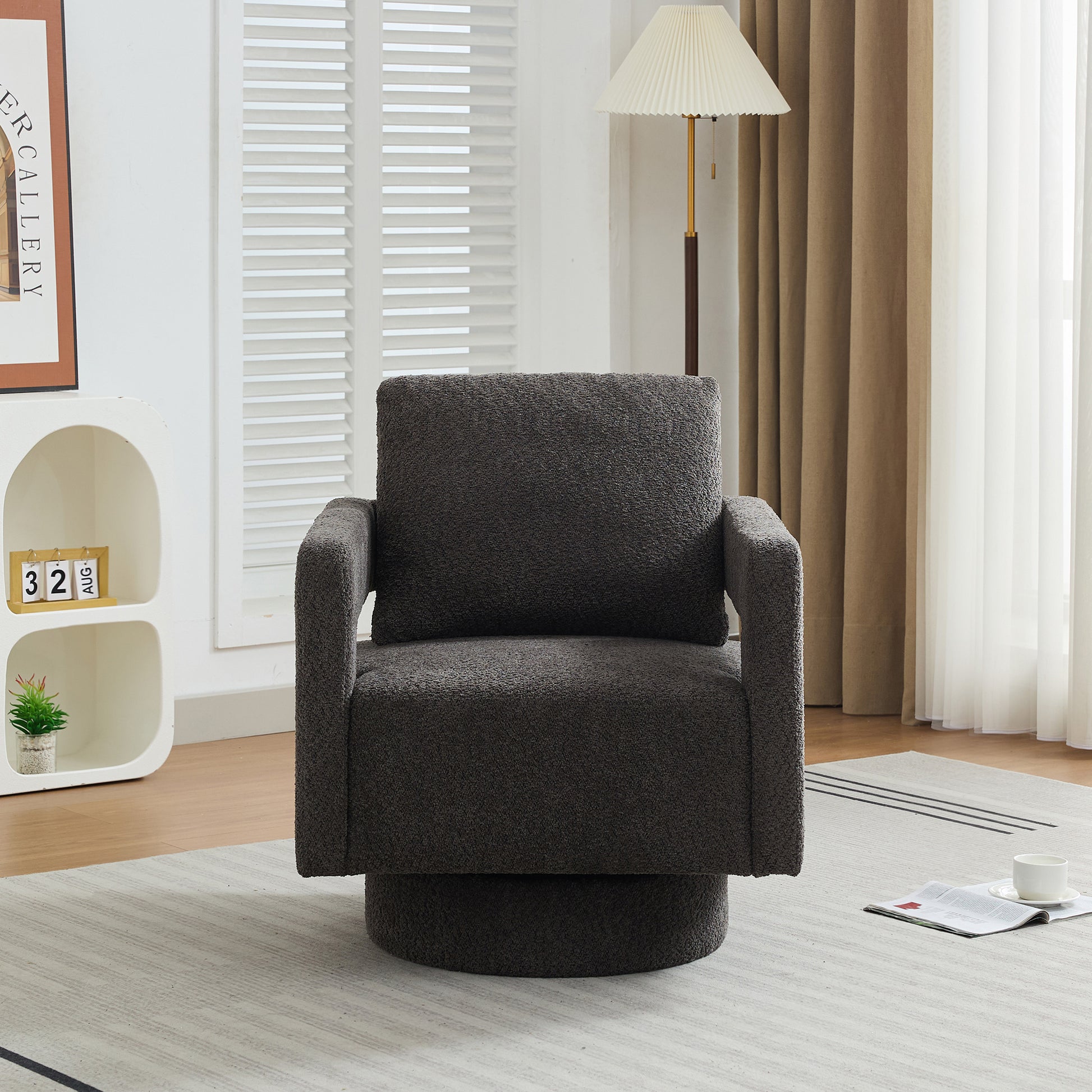 Dark gray boucle fabric swivel armchair with plush cushioning for ultimate comfort